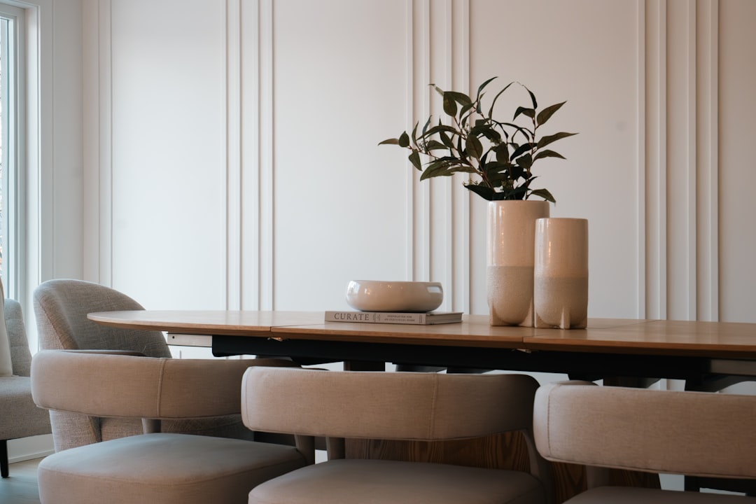 Modern dining room with oval table and chairs.